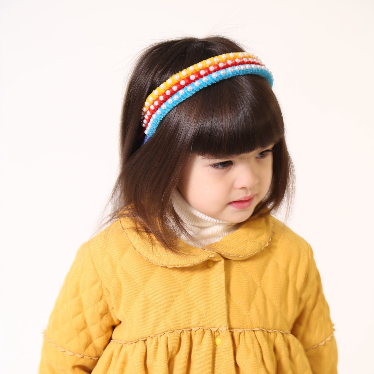 Vibrant chenille headband wrapped in playful pipe cleaners, lined with pearls at the crown, adding charm to any hairstyle. Colour: sky blue, Tia Cibani. /Vibrant chenille headband wrapped in playful pipe cleaners, lined with pearls at the crown, adding charm to any hairstyle. Colour: yellow, Tia Cibani.