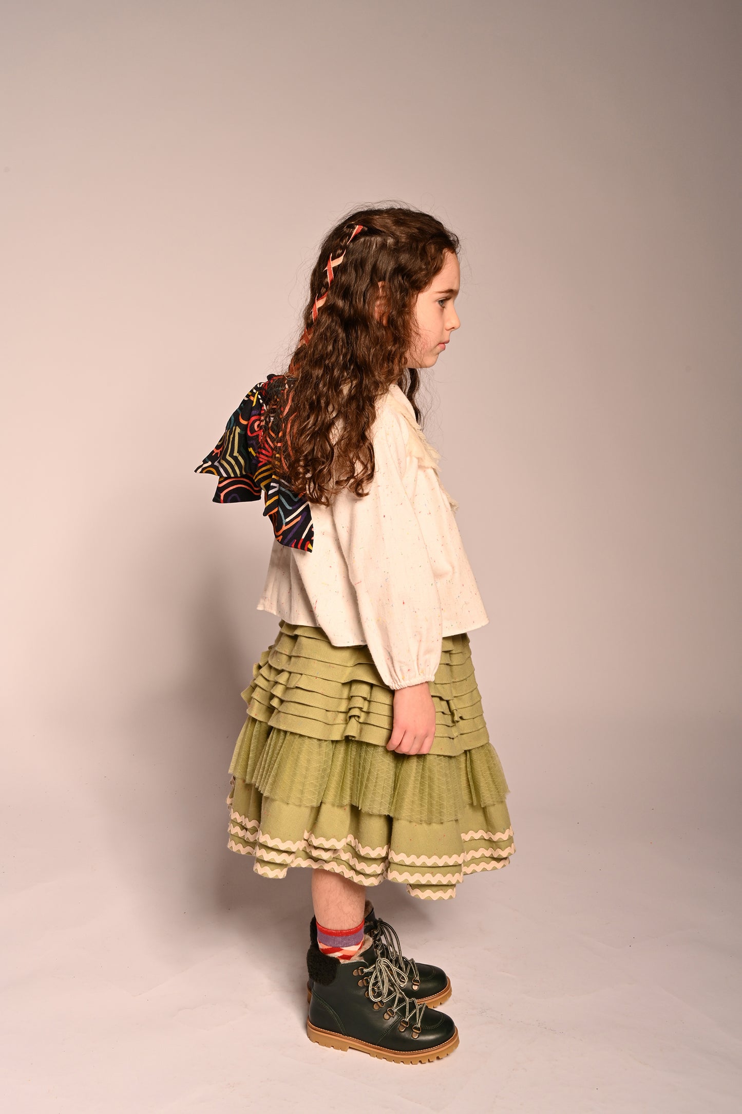 girl wearing green cotton layered with tulle skirt