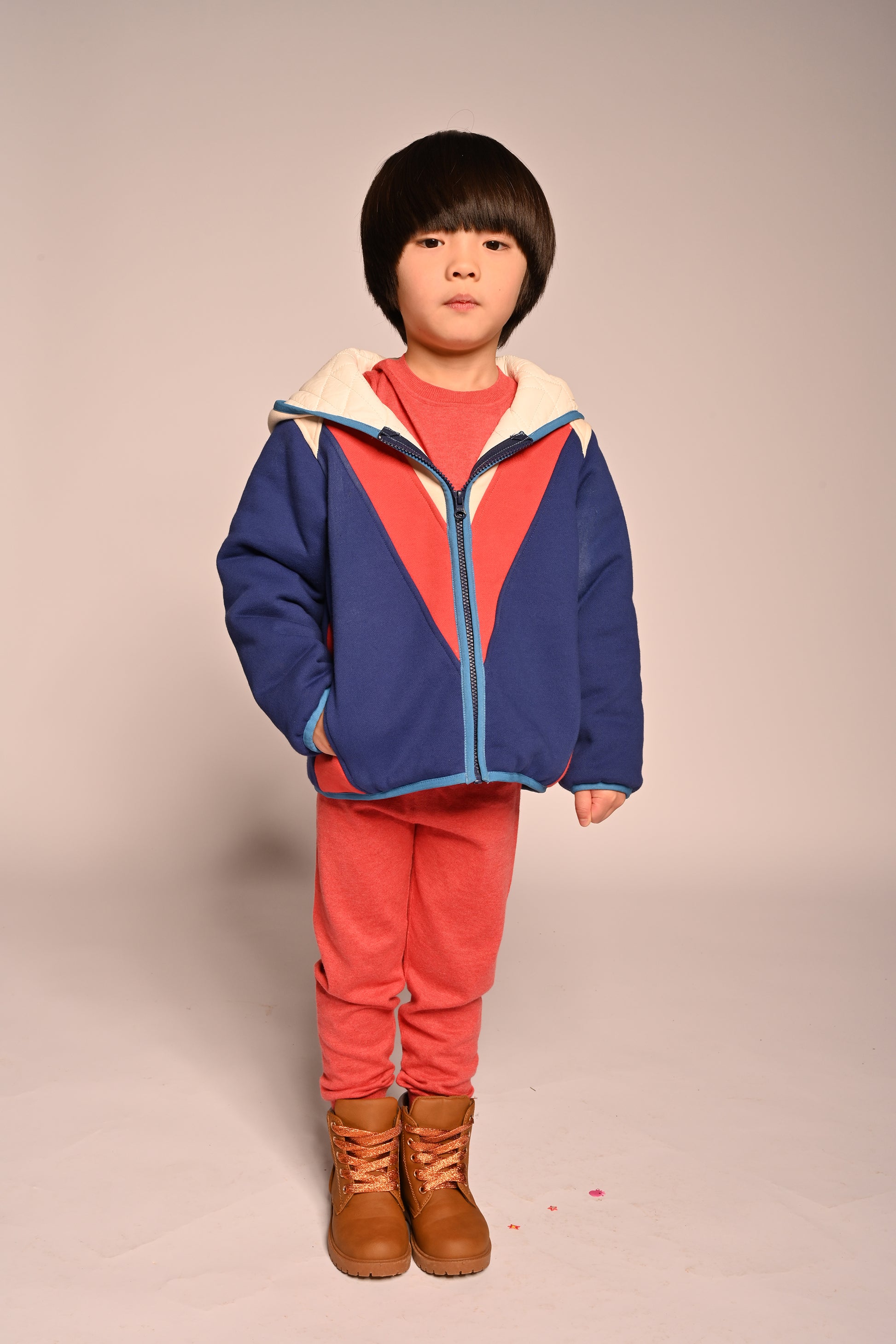 boy wearing patchwork red white and blue cotton fleece zip up hoodie by TiA CiBANi