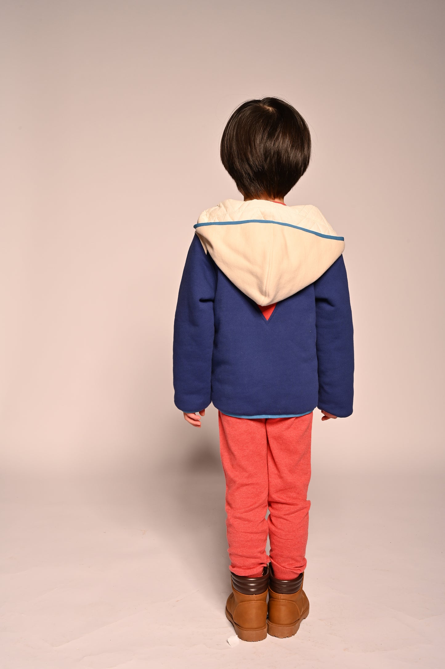 boy wearing patchwork red white and blue cotton fleece zip up hoodie by TiA CiBANi