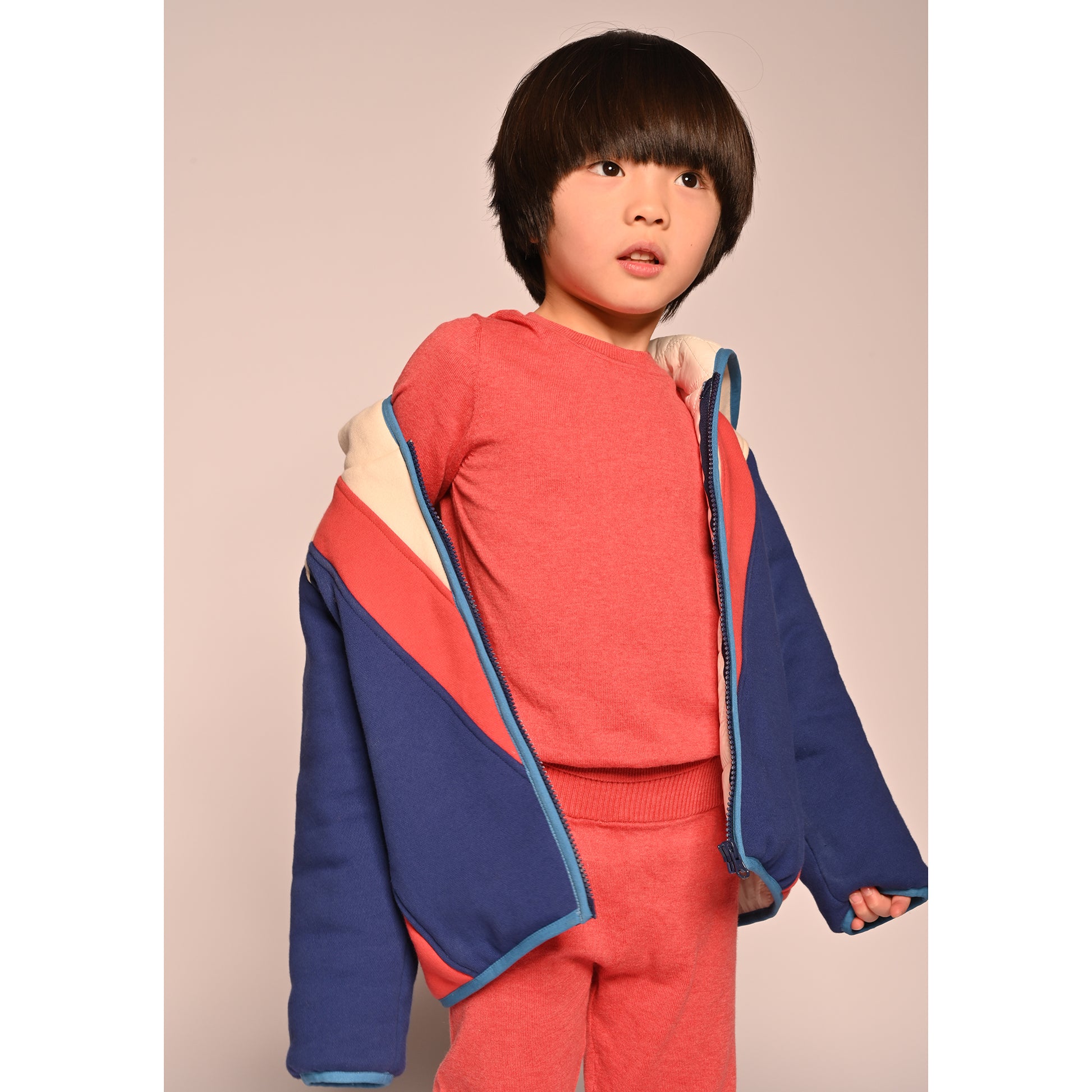 boy wearing patchwork red white and blue cotton fleece zip up hoodie by TiA CiBANi