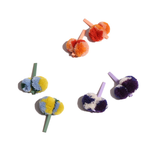 set of 6 hair clips with multicolor pom poms