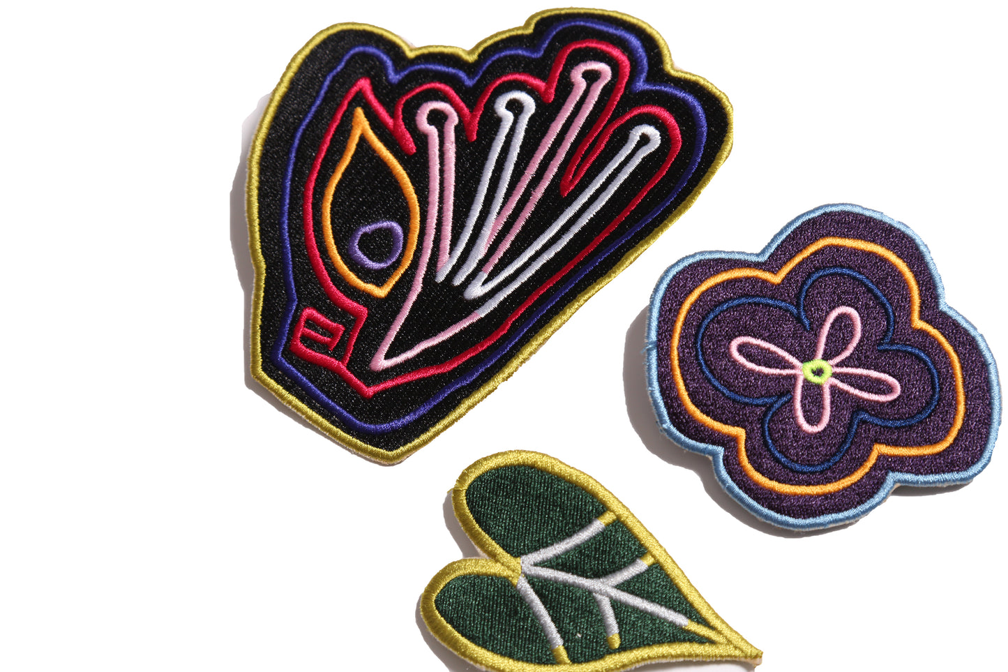 set of three embroidered brooches