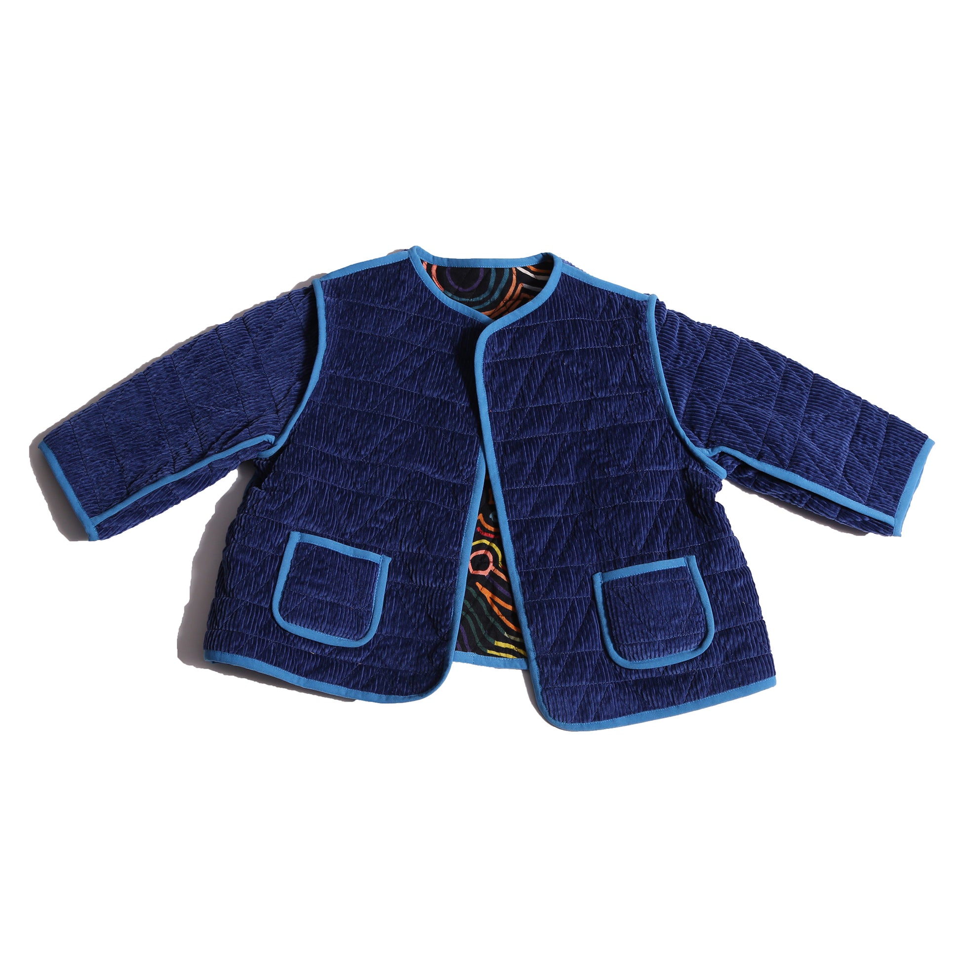 girls reversible corduroy cotton jacket in blue and multicolor print