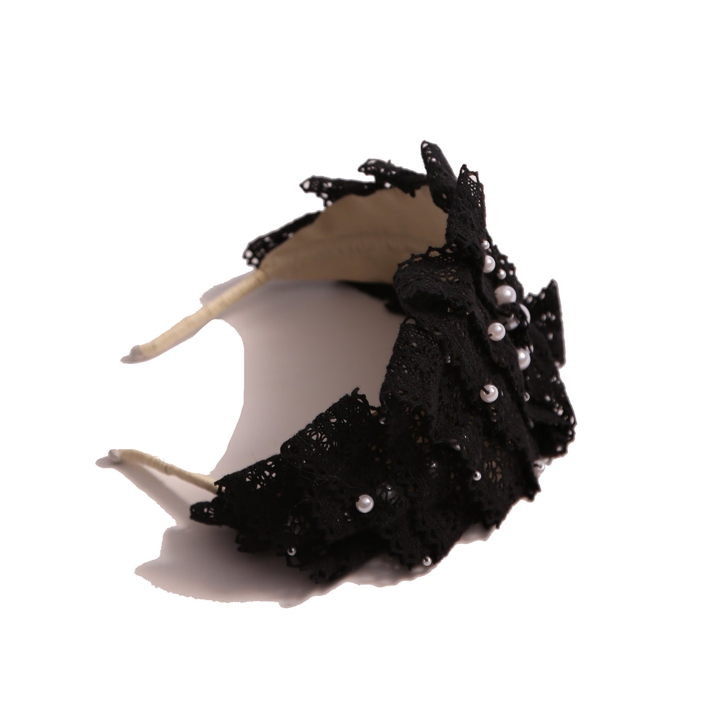 Tiara headband crafted with taffeta base, pleated lace trim at crown, and hand-stitched pearls, black, Tia Cibani.