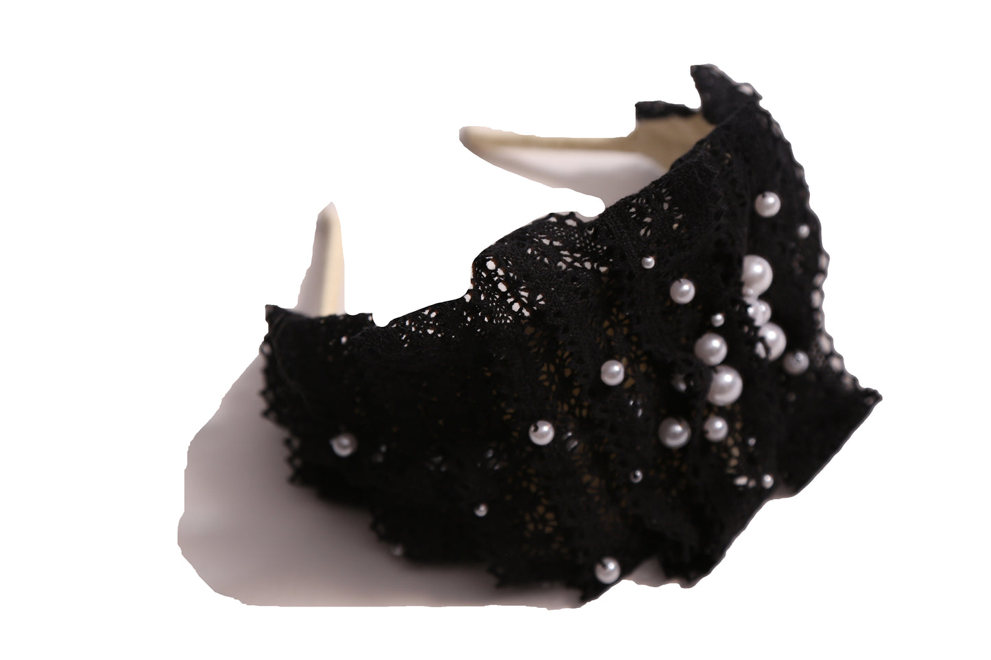 Tiara headband crafted with taffeta base, pleated lace trim at crown, and hand-stitched pearls, black, Tia Cibani.