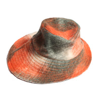 Stylish bucket hat in timeless Celtic Shadow Plaid pattern, adding classic charm to any outfit. Topstitch thread detailing along the brim for a nice finishing touch. Wide brim at the back for excellent protection and contemporary look. Mainly orange, Tia Cibani.