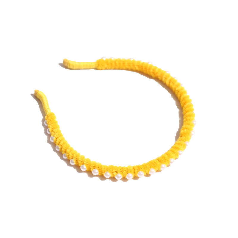 Vibrant chenille headband wrapped in playful pipe cleaners, lined with pearls at the crown, adding charm to any hairstyle. Colour: yellow, Tia Cibani.