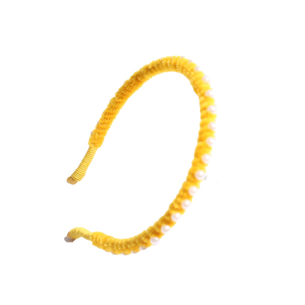 Vibrant chenille headband wrapped in playful pipe cleaners, lined with pearls at the crown, adding charm to any hairstyle. Colour: yellow, Tia Cibani.