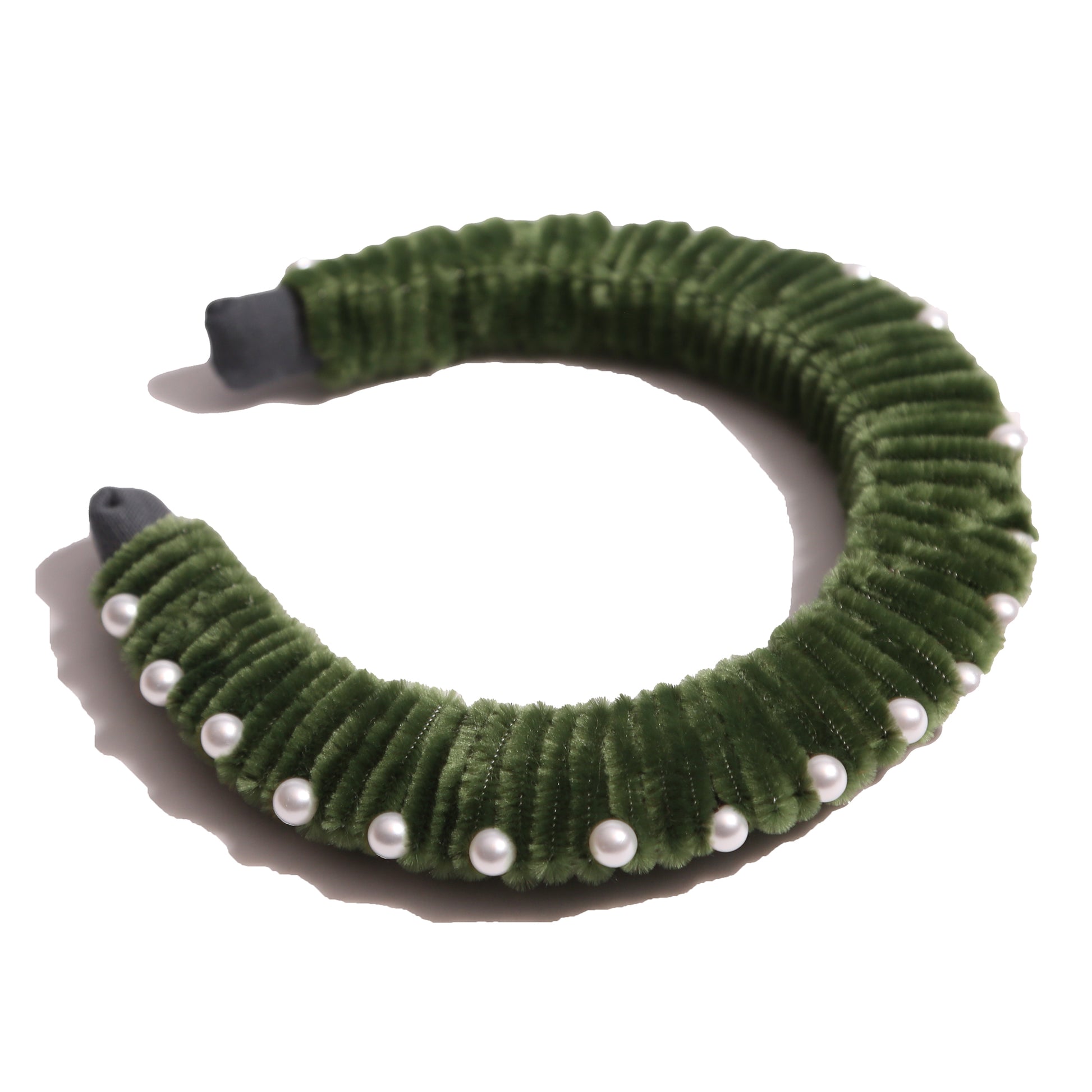 Oversized headband crafted with playful pipe cleaners, finished with delicately placed pearls at the crown. Colour: Green, Tia Cibani.