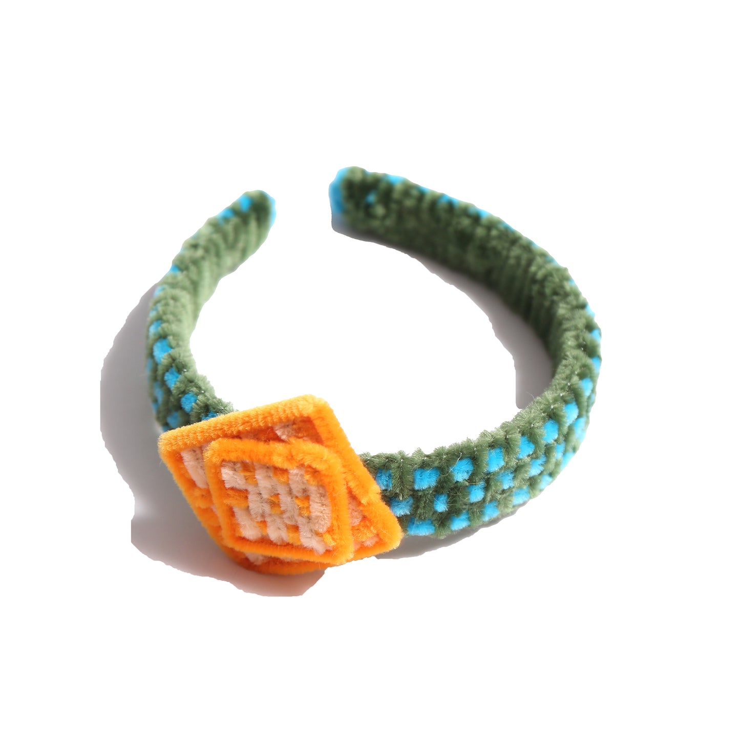 Headband wrapped and weaved in artistic two-tone effect using vibrant pipe cleaners. Topped with layers arranged asymmetrically in charming squares. Adds pop of color and personality to any hairstyle. Colours: Yellow, Sky Blue, Green,Tia Cibani.