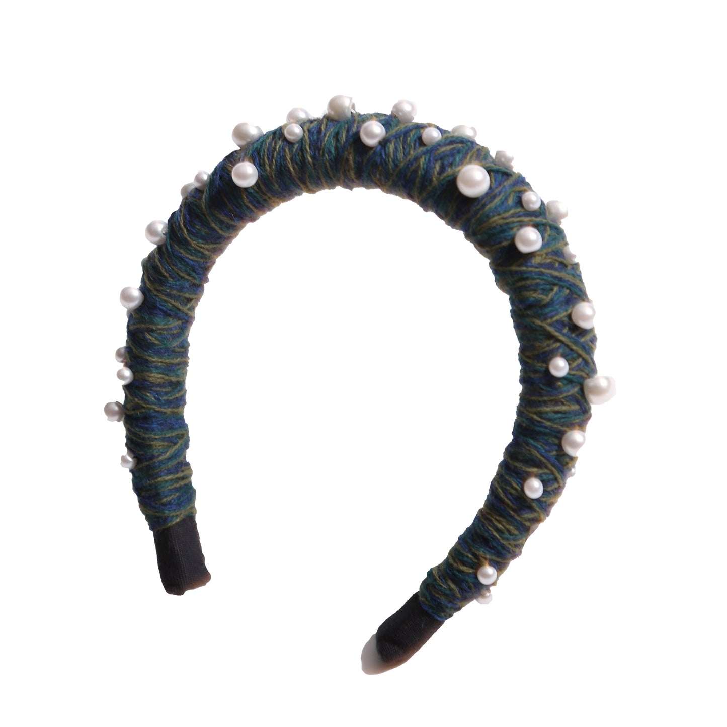 Headband covered in blue and green thread with various pearls attached, by Tia Cibani.