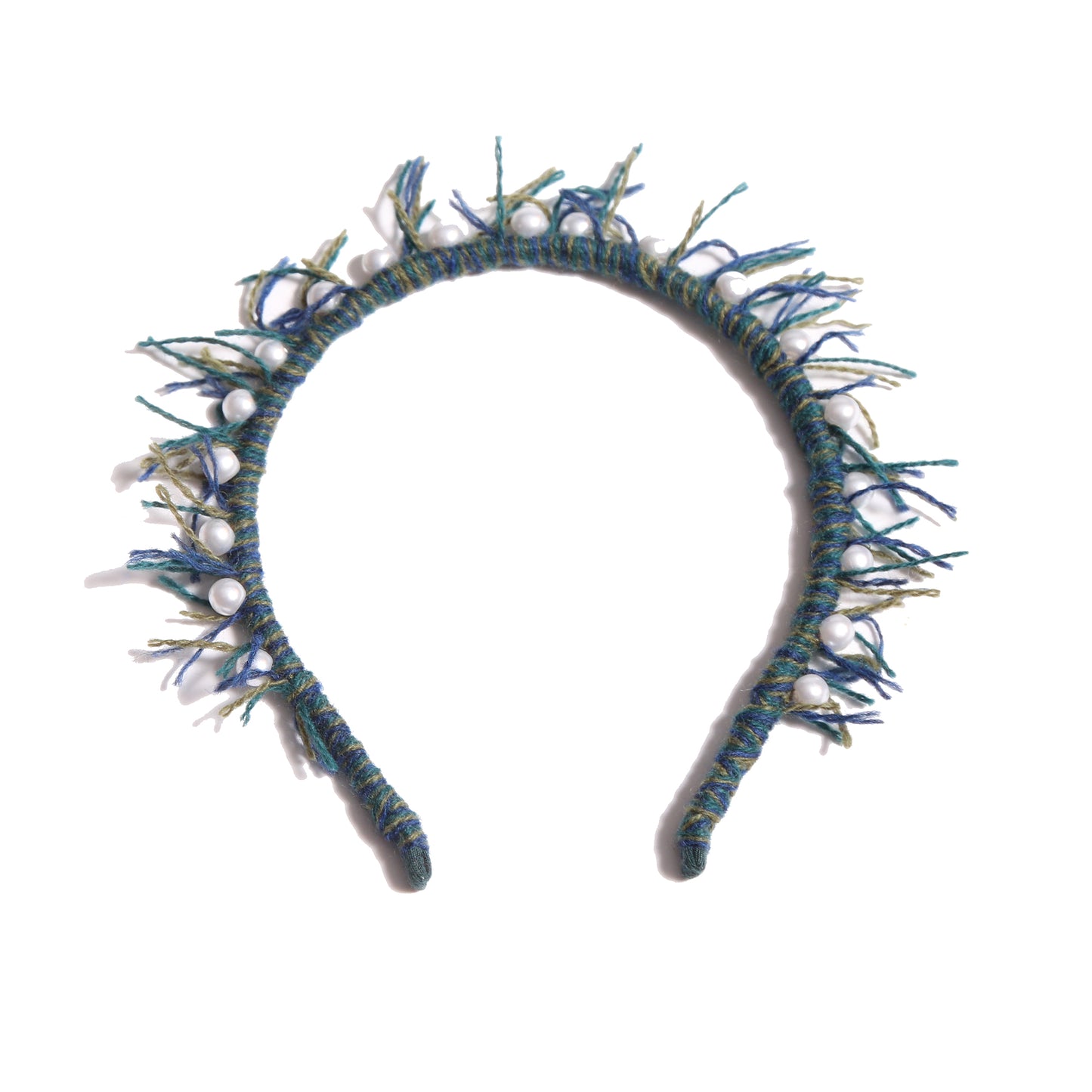 Headband wrapped in multi-colored, predominantly blue, wool yarn, with fringing at the crown and hand-stitched pearls at the top, by Tia Cibani.