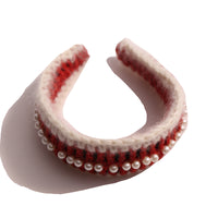 White and rouge oversized headband wrapped and crocheted with mohair and wool yarn, adorned with pearls at the crown, Tia Cibani.