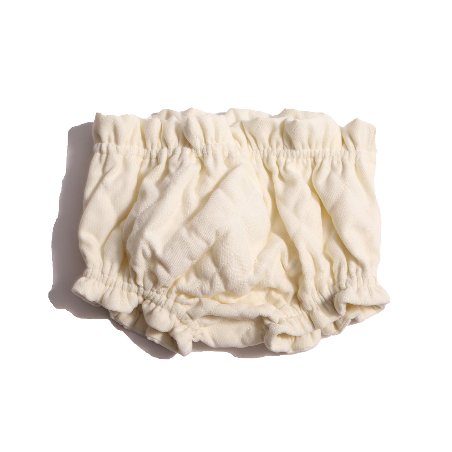 Soft, tufted bloomers for babies with gathered elastic waist and leg openings, cotton lined for comfort and style this fall. Pairs beautifully with Harlequin Tufted Topper. White, Tia Cibani.