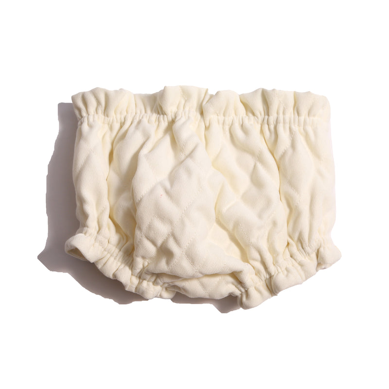 Soft, tufted bloomers for babies with gathered elastic waist and leg openings, cotton lined for comfort and style this fall. Pairs beautifully with Harlequin Tufted Topper. White, Tia Cibani.