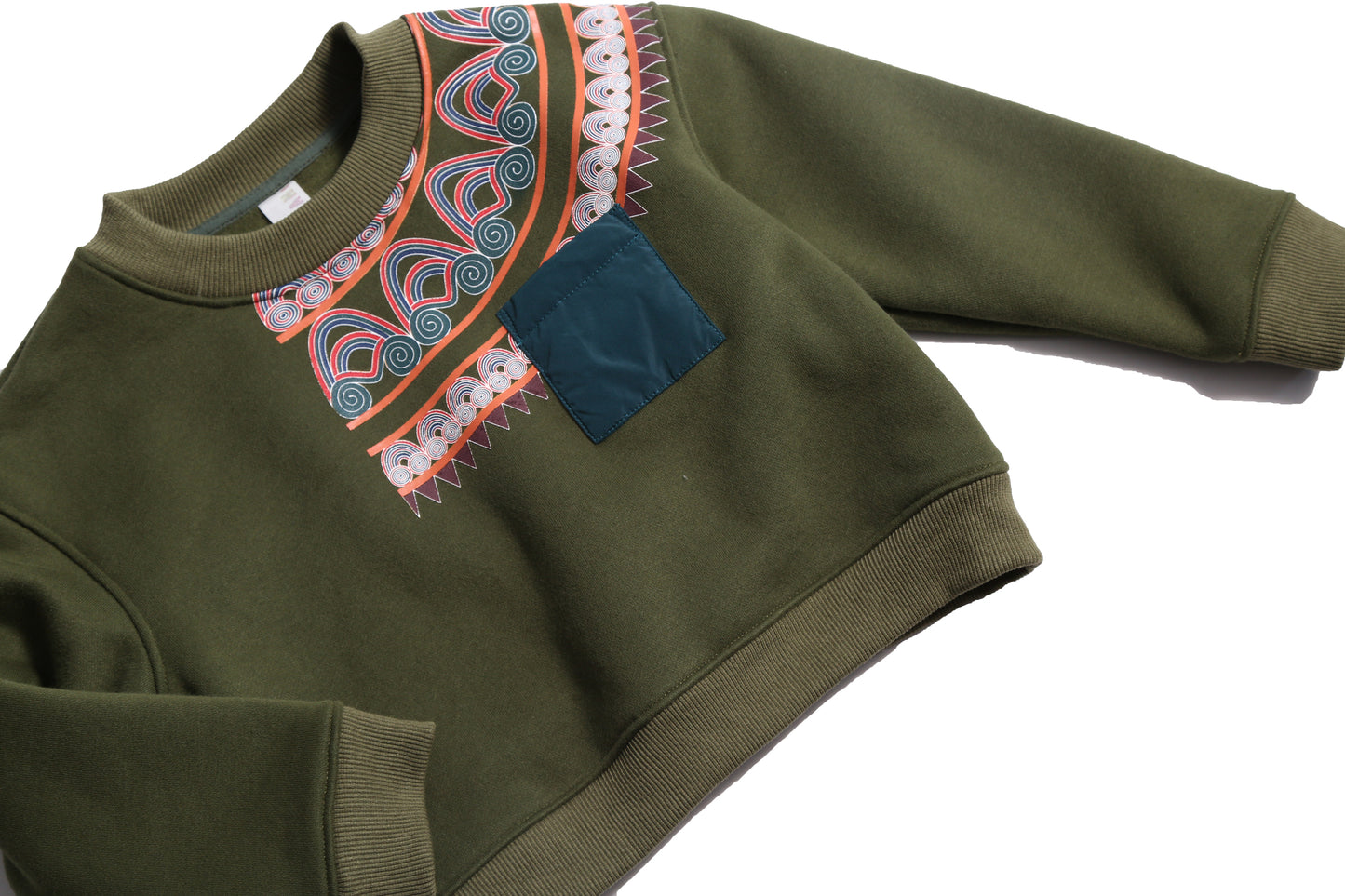 Sueded Fleece jersey pullover for boys, featuring long sleeves, tonal jersey ribbing at neckline, hem, and cuffs for comfort and style. Colorful asymmetric screen print at shoulder. Taffeta pocket detail at left chest for treasures. Dropped shoulders, relaxed fit. Chervil, Tia Cibani.