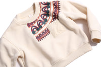 Sueded Fleece jersey pullover for boys, featuring long sleeves, tonal jersey ribbing at neckline, hem, and cuffs for comfort and style. Colorful asymmetric screen print at shoulder. Taffeta pocket detail at left chest for treasures. Dropped shoulders, relaxed fit. White, Tia Cibani.