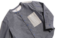 This season's Finn Classic Snap Shirt in patchwork Chambray Cotton Shirting and lightweight striped cotton shirting at pocket and yoke. Snaps at center front and cuffs, high-low scoop hem, long sleeves. Colour: Blue, Tia Cibani.