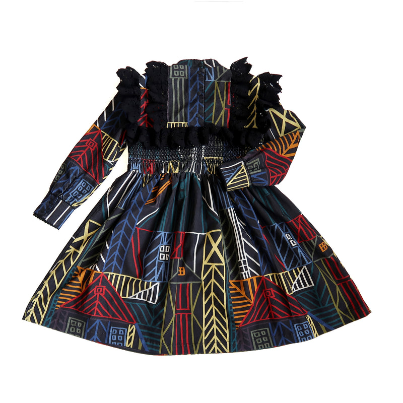 Flared long sleeve frock in this season's Normanz print on soft corduroy features black color smocking at the bodice, Multicolour, Tia Cibani.