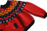 Long-sleeve sweater primarily red, with accents of blue and orange, made of Yarn fabric, by Tia Cibani. Detail.