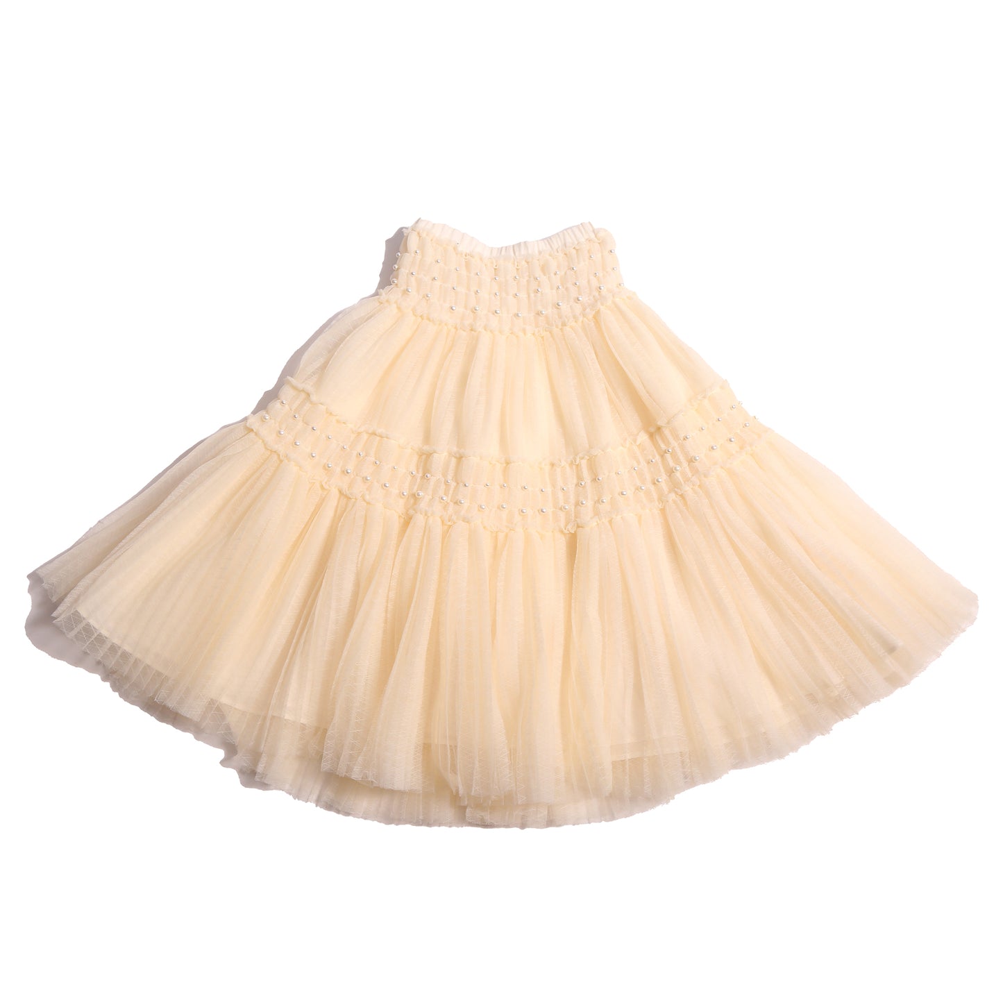 Maxi length Argyle Tulle skirt with pearls and elasticized tonal smocking panels at waist and hips. Deep pleats for volume, lined in tonal cotton lining with elastic pull-on waistband. Two layers of tulle for a princess-like feel. Colour: Opal, Tia Cibani.