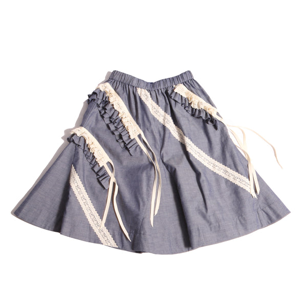 Everyday tealength skirt in soft Chambray Cotton Shirting with diagonal 3-D self ruffles and lace embellishments. Easy elastic waistband for comfortable fit. Pair with Gael Ruffled Collar Blouse for complete look. Colour: Blue, Tia Cibani.