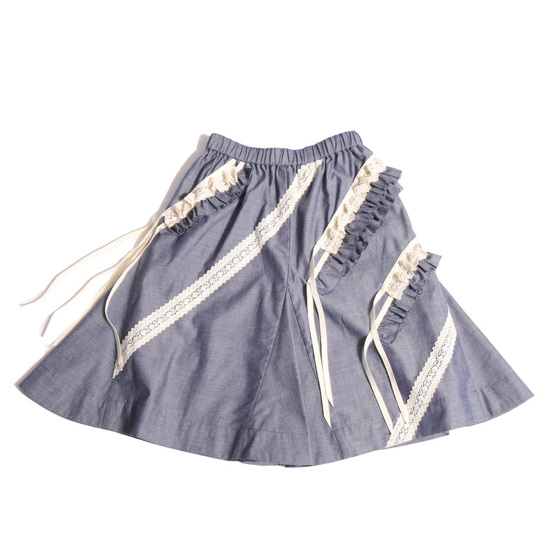 Everyday tealength skirt in soft Chambray Cotton Shirting with diagonal 3-D self ruffles and lace embellishments. Easy elastic waistband for comfortable fit. Pair with Gael Ruffled Collar Blouse for complete look. Colour: Blue, Tia Cibani.