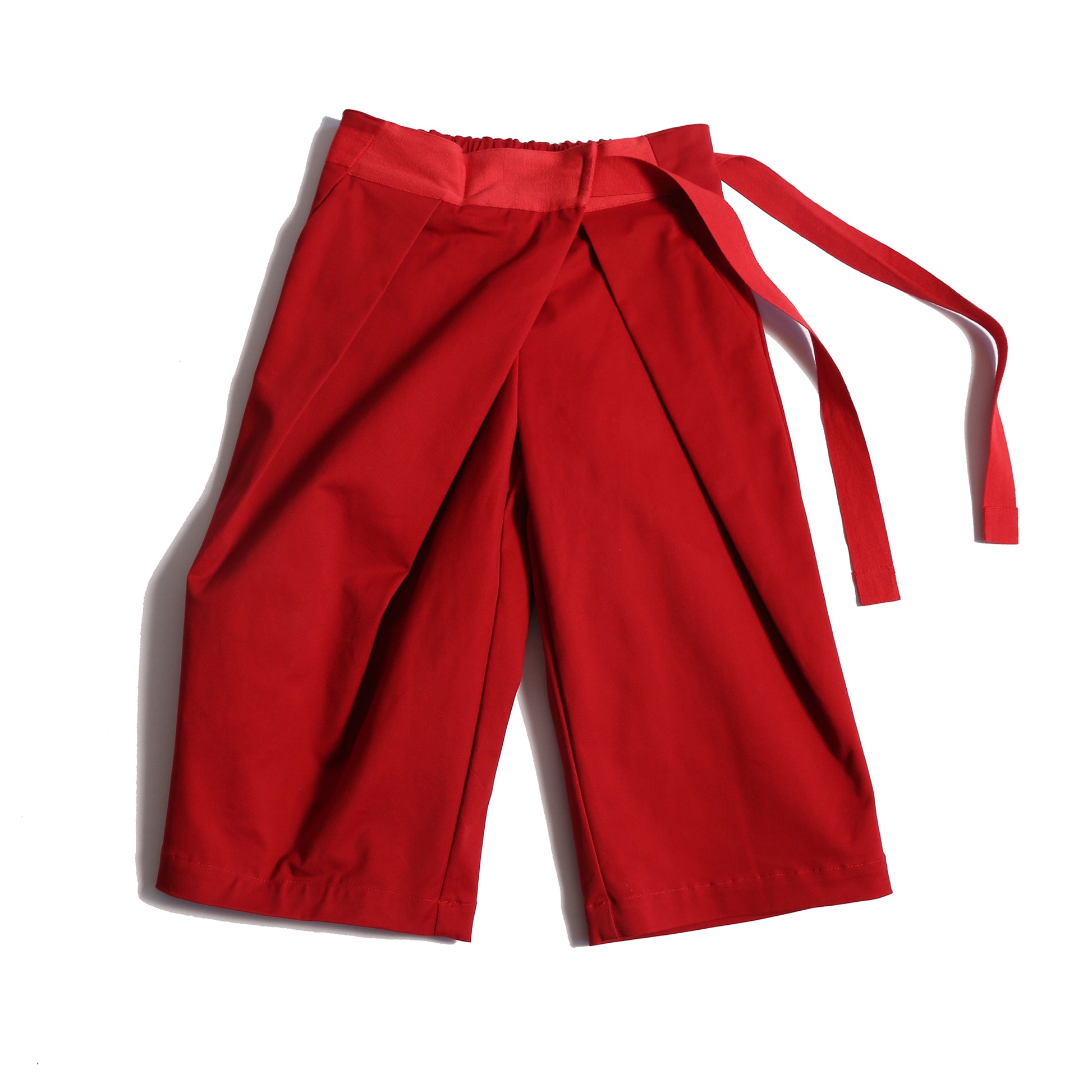 Deep pleated trousers designed for comfort and style, featuring an easy elastic waistband with ribbon tie detailing for a charming bow at the side waist. Crafted in comfortable Chamois Cotton Twill, unlined for lightweight feel, perfect for everyday wear. Complete with slant pockets at side seams. Pair with Gwenn Collared Topper for a complete look. Rouge, Tia Cibani.