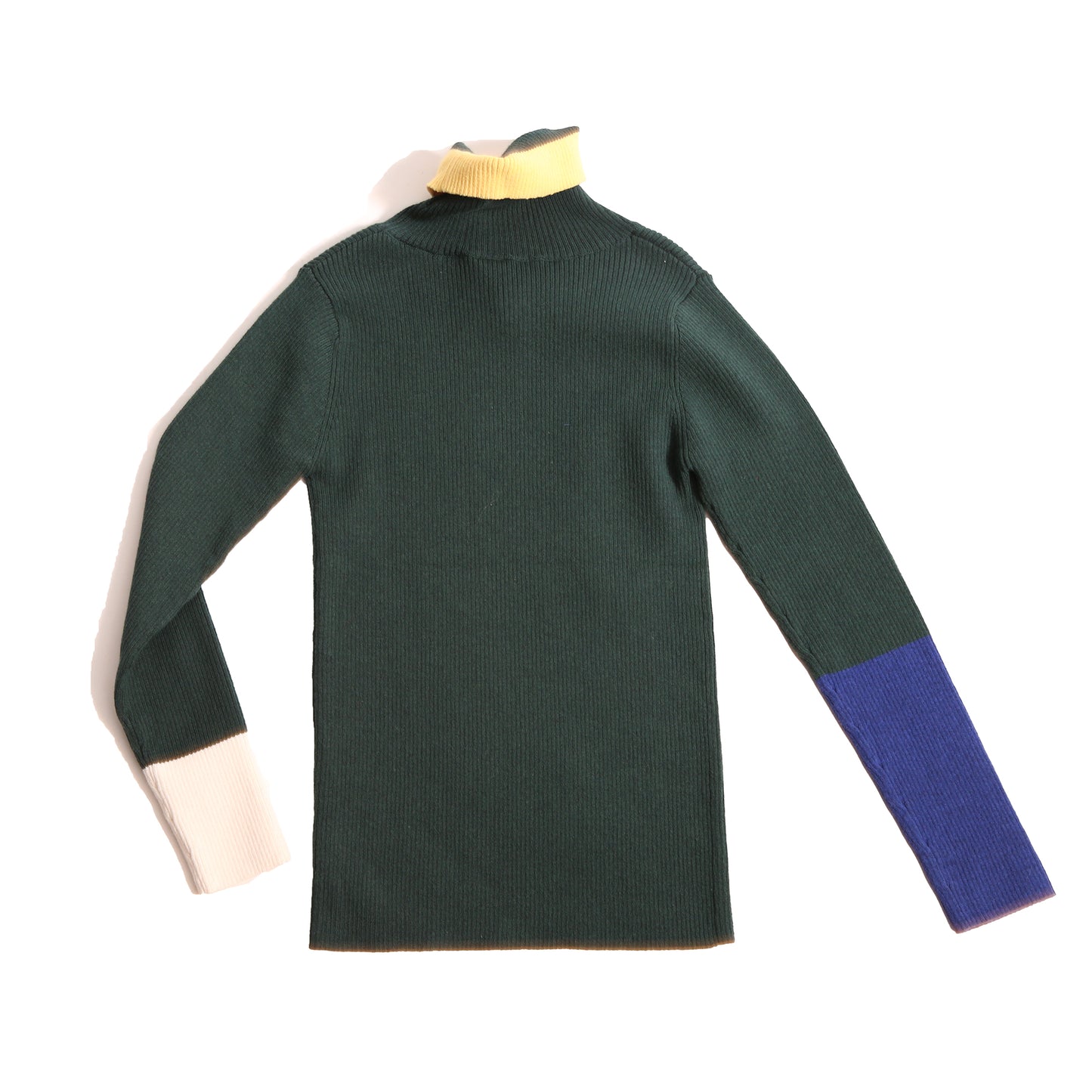 Slim fit, all-over ribbed turtleneck featuring colorblocking and contrast patchwork detailing at sleeves and neckline in this season's fine knit yarn colors. Ideal for wearing alone or as a layering piece in chilly seasons. Celtic, Tia Cibani.