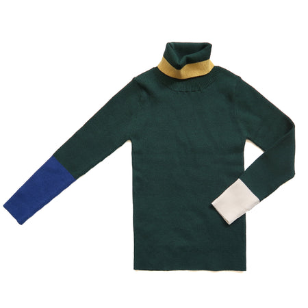 Slim fit, all-over ribbed turtleneck featuring colorblocking and contrast patchwork detailing at sleeves and neckline in this season's fine knit yarn colors. Ideal for wearing alone or as a layering piece in chilly seasons. Celtic, Tia Cibani.